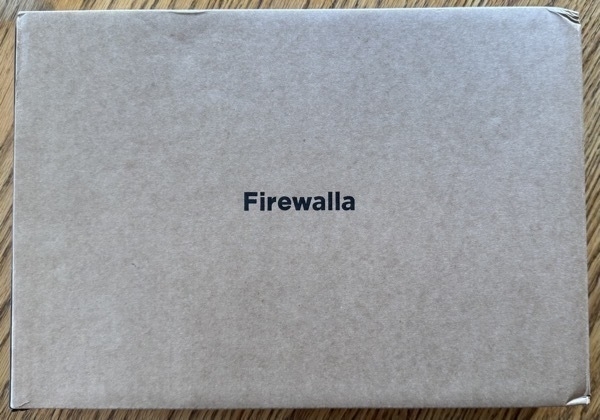 Cardboard box with 'Firewalla' printed in the center