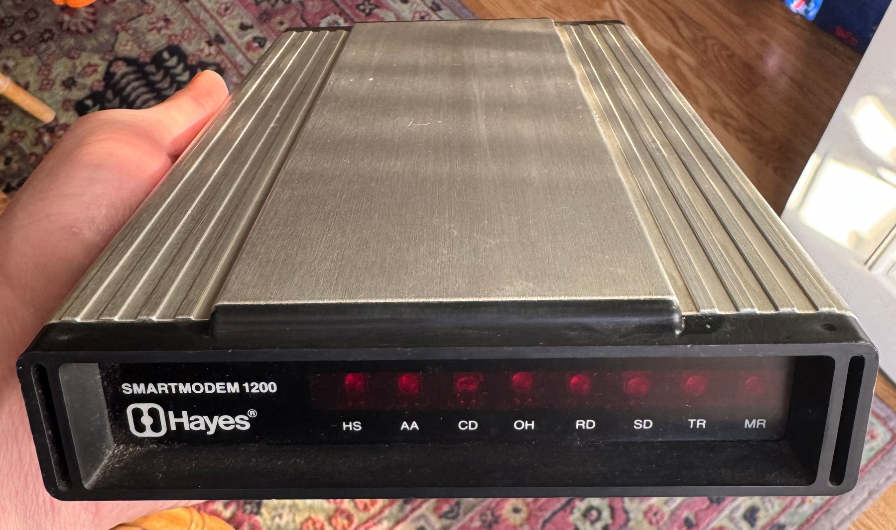 Closeup of a Hayes Smartmodem 1200, model 07-0038, looking sleek and fast in its aluminum case.