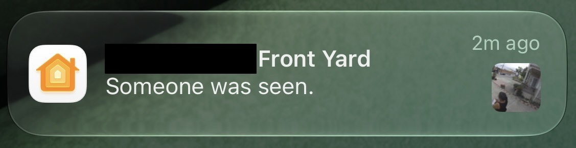 Screenshot of a Homekit notification: "[redacted] Front Yard, Someone was seen."