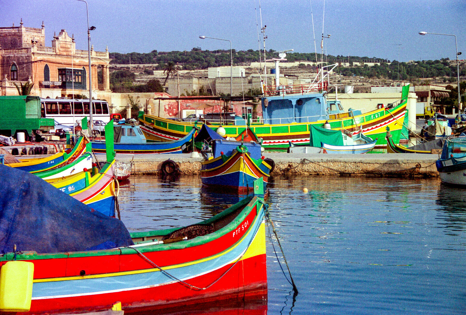 Colourful boats in a harbour in Malta.