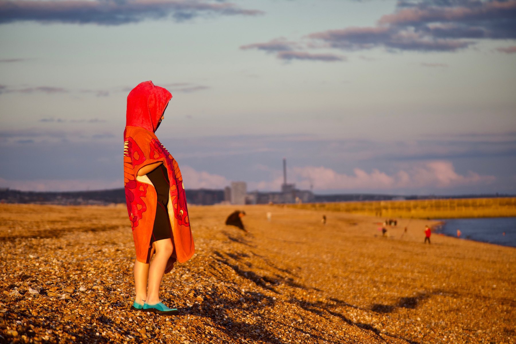 A young girl on Shoreham Beach after her sea swim. 