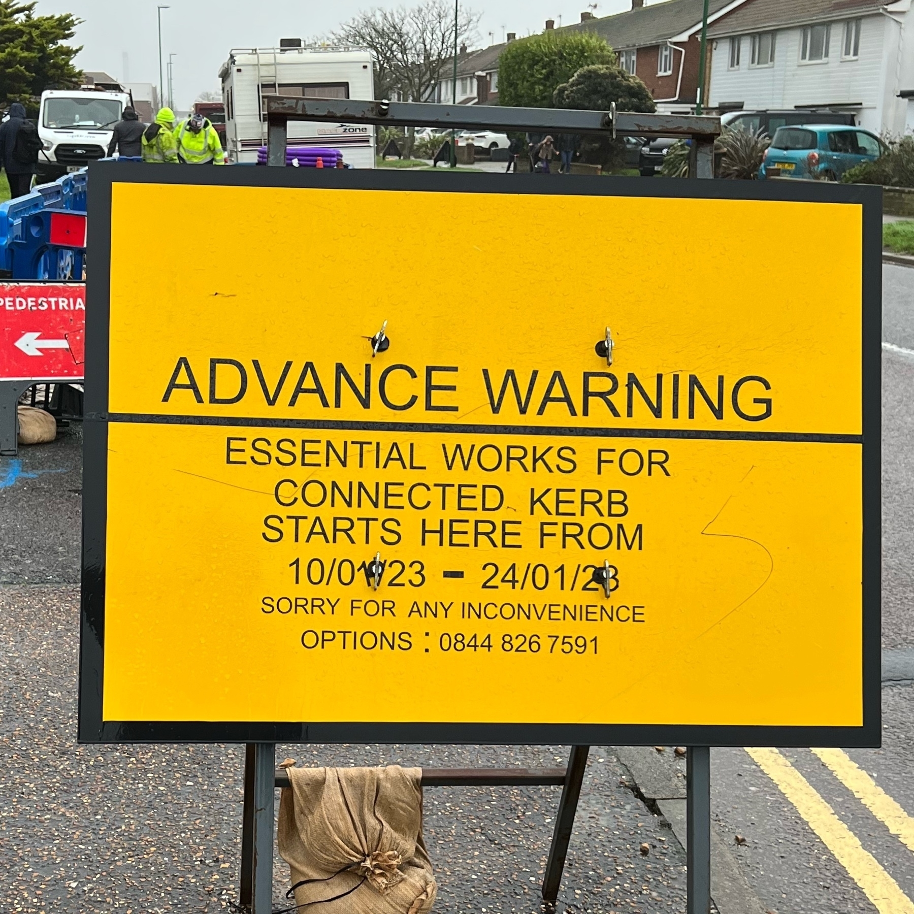 A sign warning of roadworks for EV charging infrastructure. 