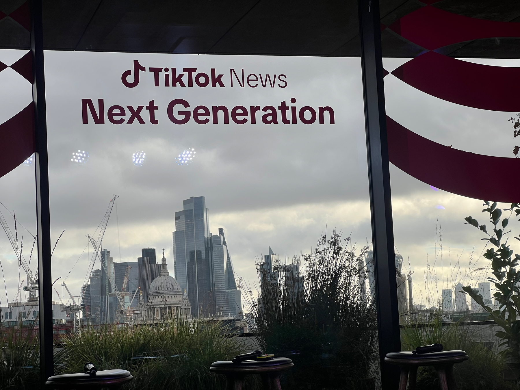 A window displays the text TikTok News Next Generation with a city skyline visible in the background.