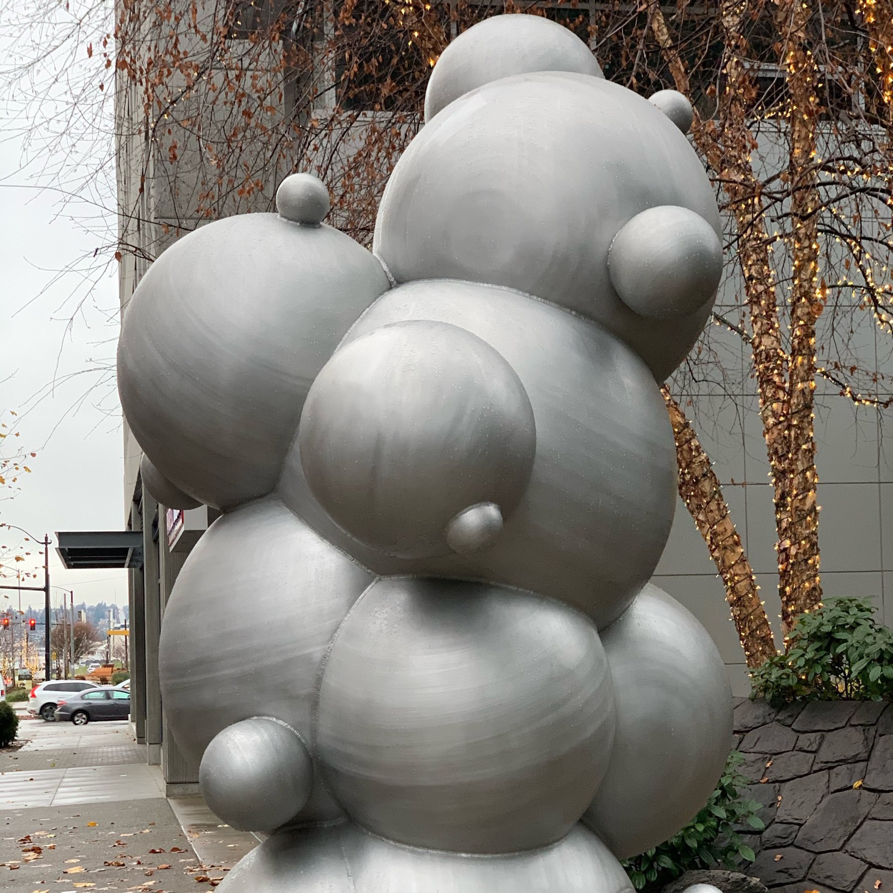 a sculpture of metal spheres which from this angle looks like a mutating teddy bear