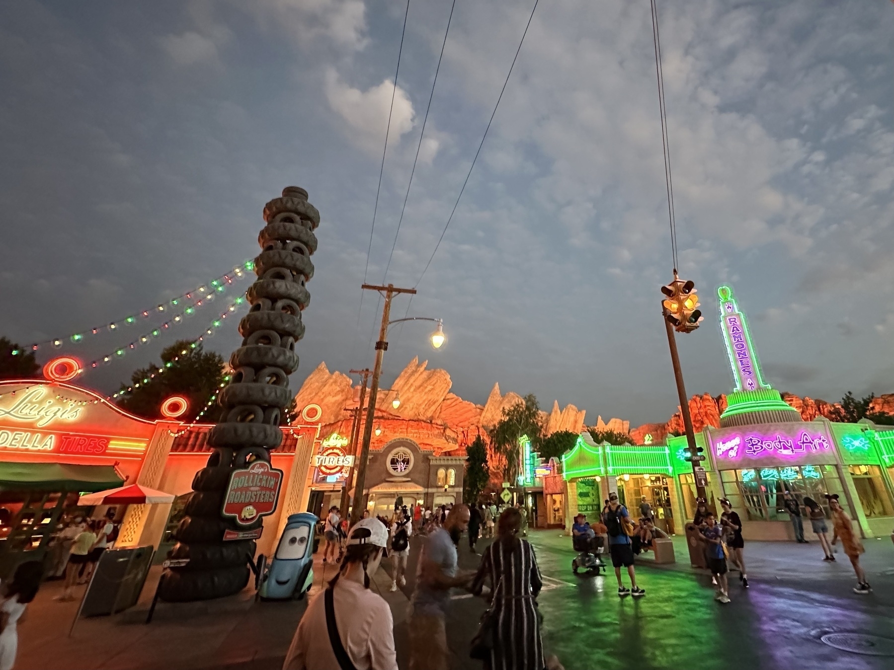 Radiator Springs lit up at night. Luigi’s Rollickin’ Roadsters on the left.