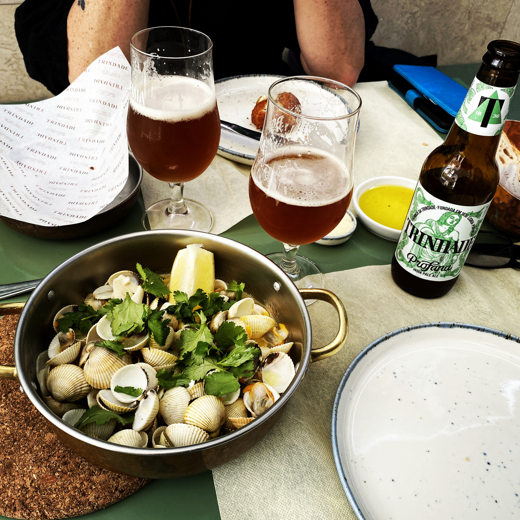 Bowl of cockles and two glasses of beer
