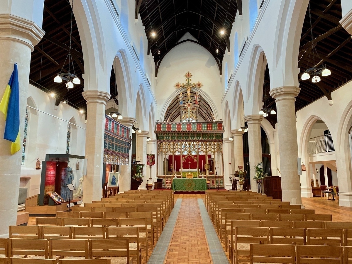 Church interior showing rows of seating and altar