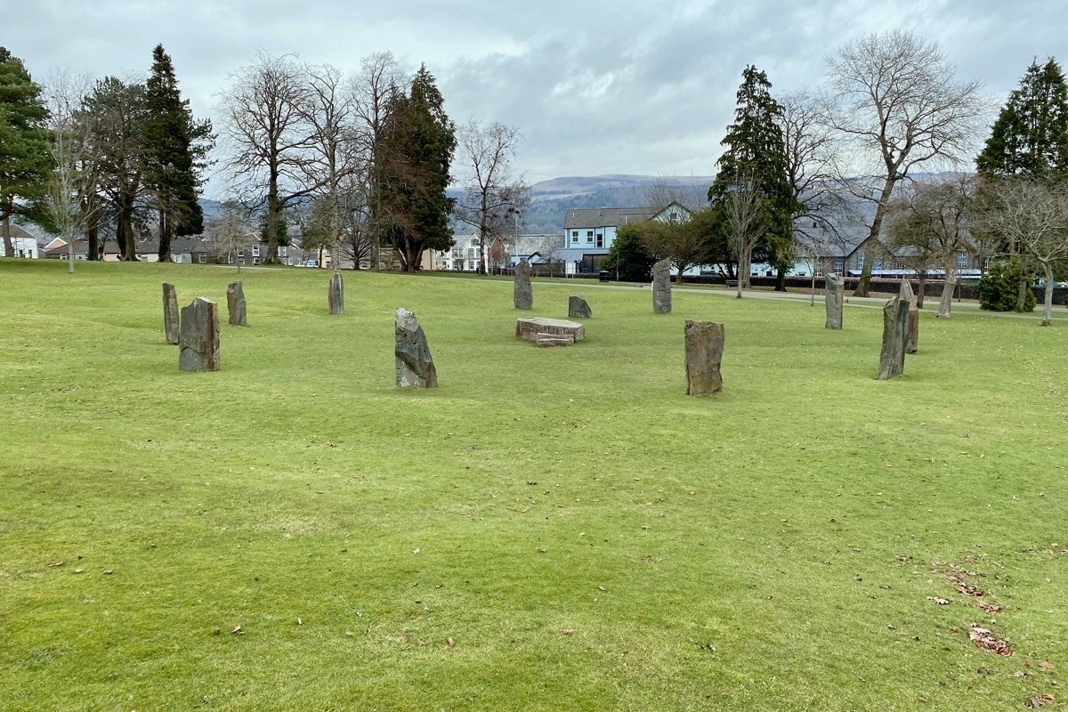 Circle of standing stones on a grass surface