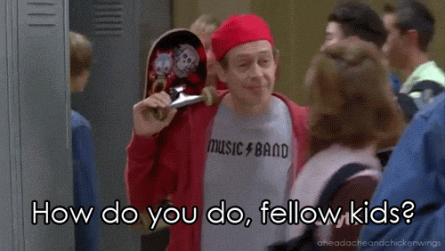 A person wearing a red cap, red jacket, and a "Music Band" t-shirt is holding a skateboard and addressing a group with the caption "How do you do, fellow kids?".