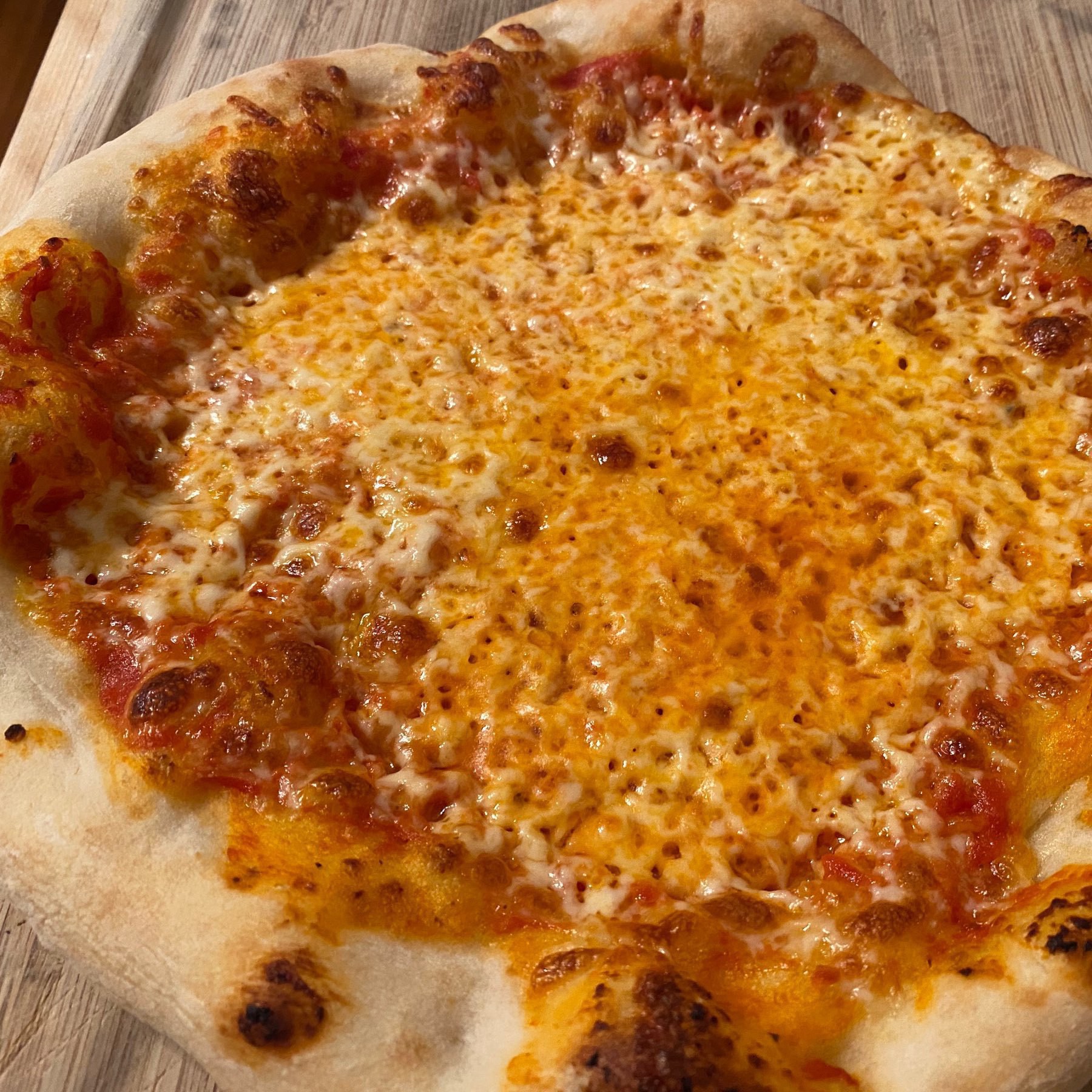 cheese pizza with large, puffy crust