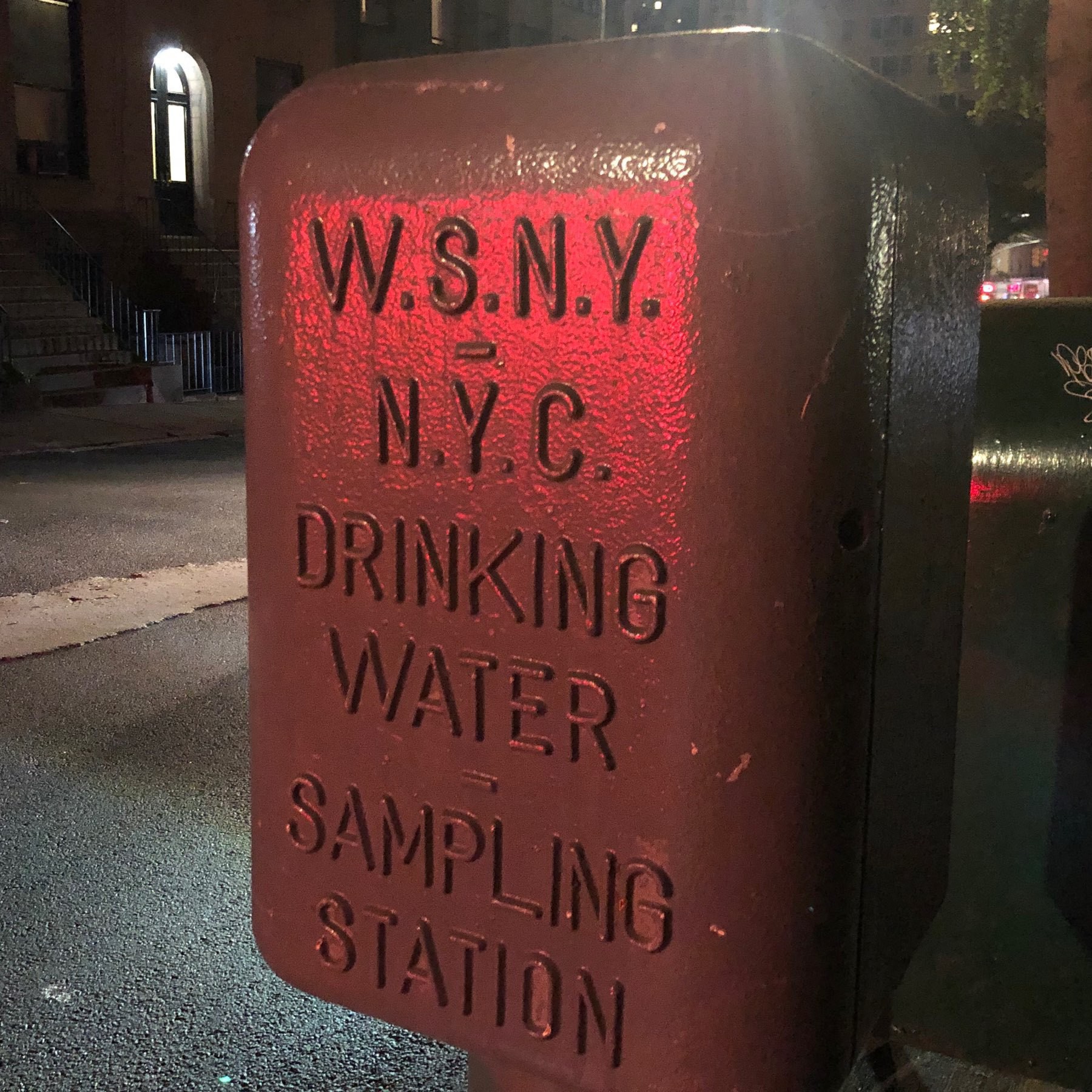 Industrial metal box with inscription "NYC Drinking Water Sampling Station."