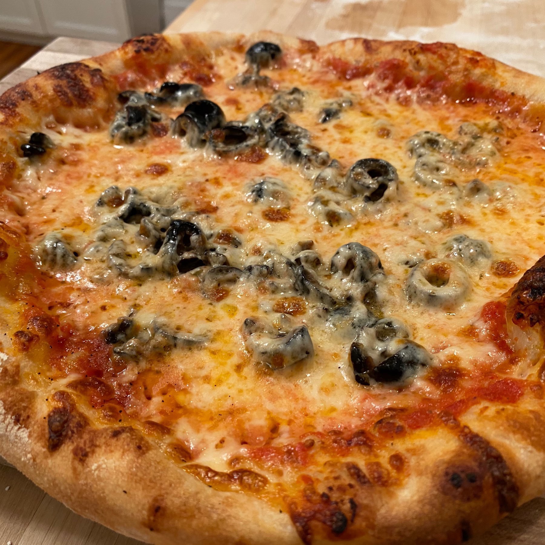 homemade olive pizza with puffy edges 