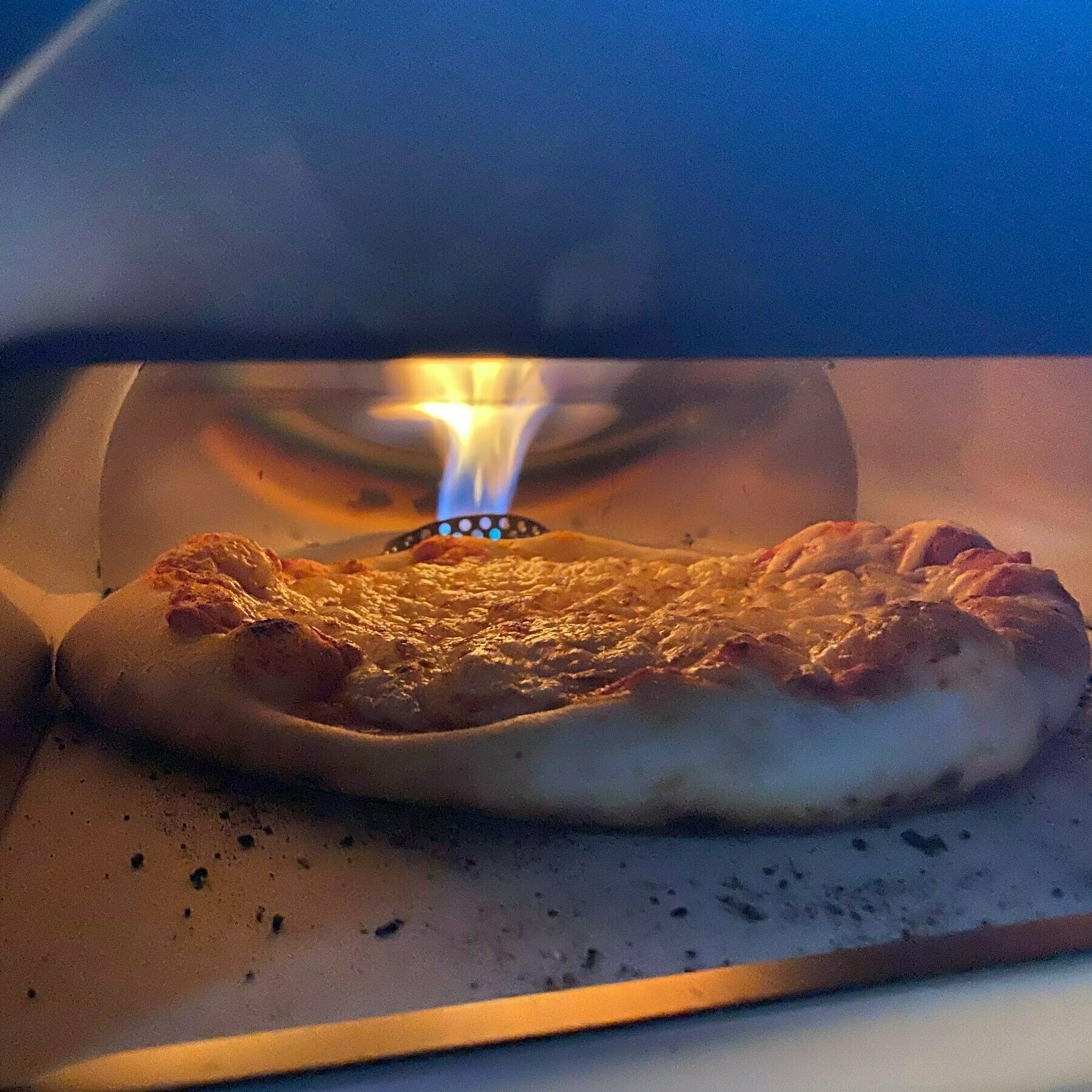 pizza cooking in a gas fired oven
