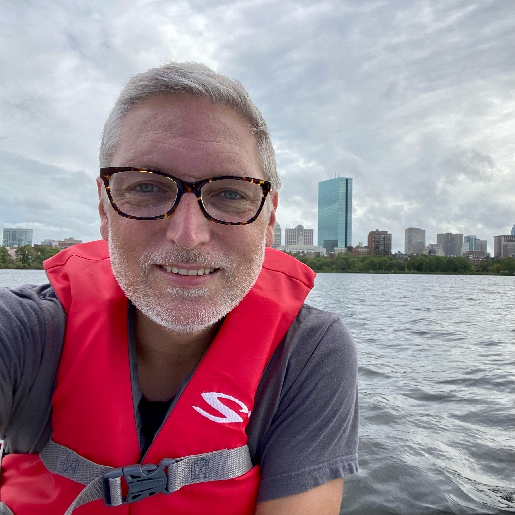 Selfie on a sailboat with Boston skyline behind me.
