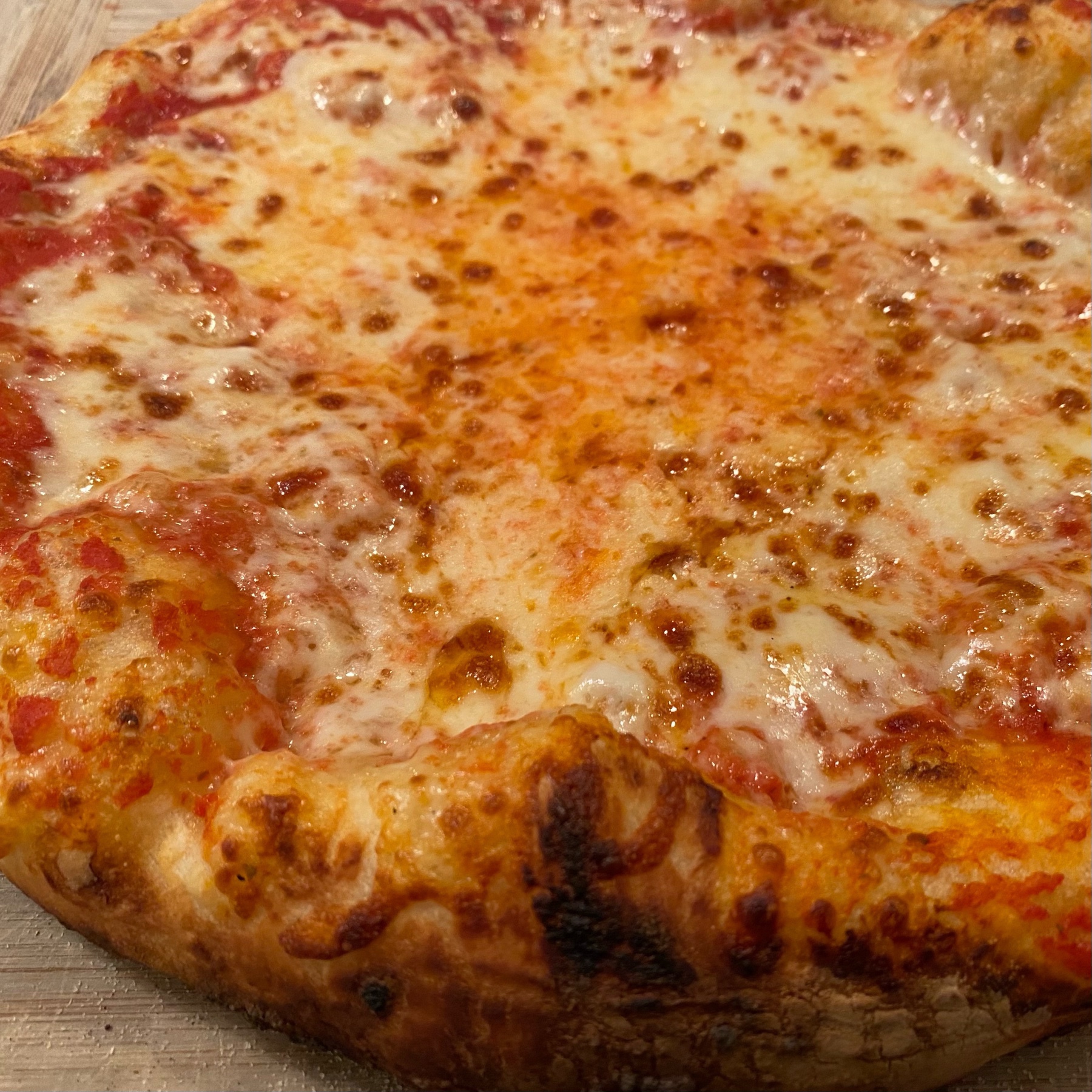 homemade cheese pizza with puffy crust