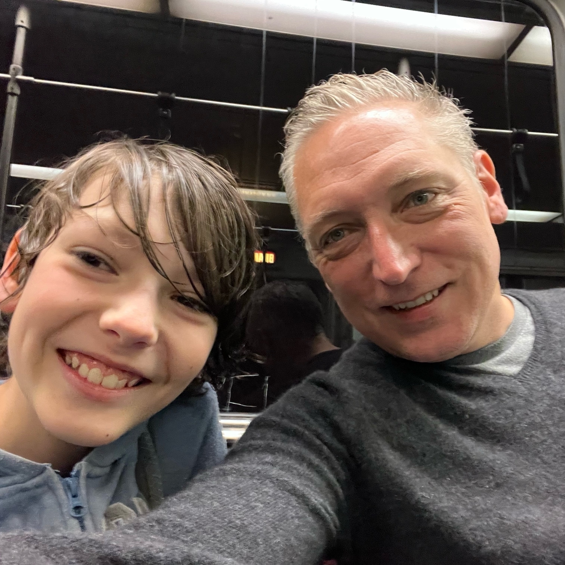 Selfie of me and my 11yo boy in a subway car.