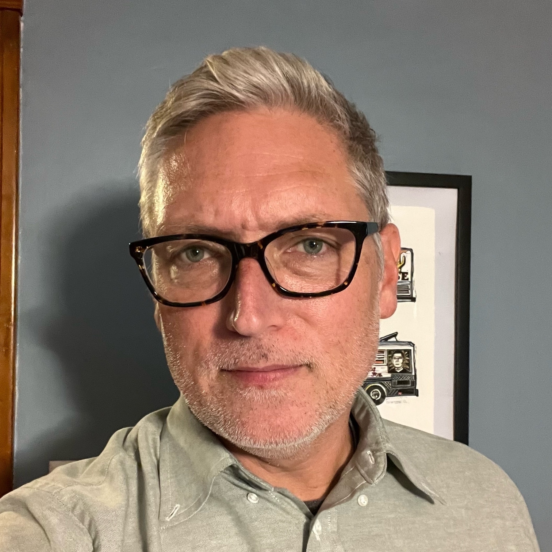selfie if a caucasian 48 yo with glasses and grey hair