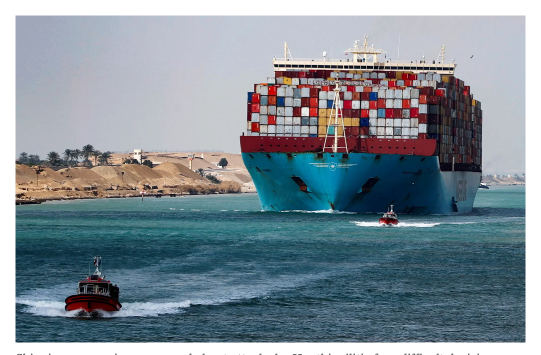 Large container ship carrying multicolored shipping containers that could be perceived as stacks of Rubik’s cubes.