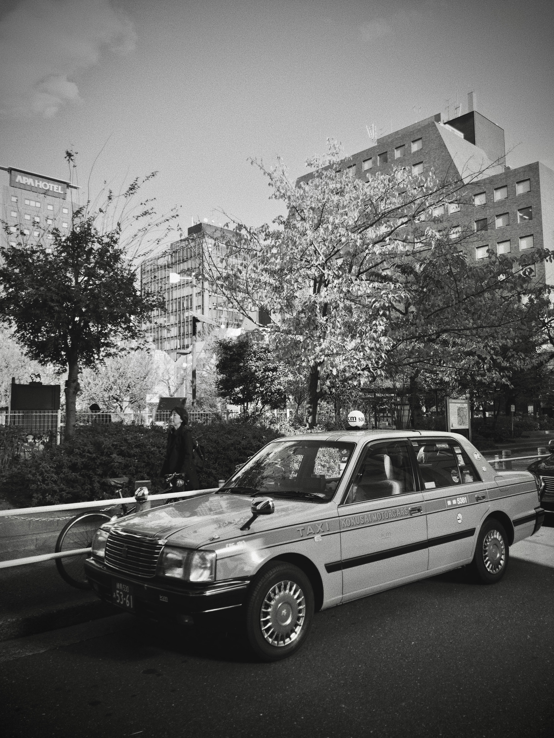 Older model sedan type taxi from Kokusai Motorcars in Tokyo. 