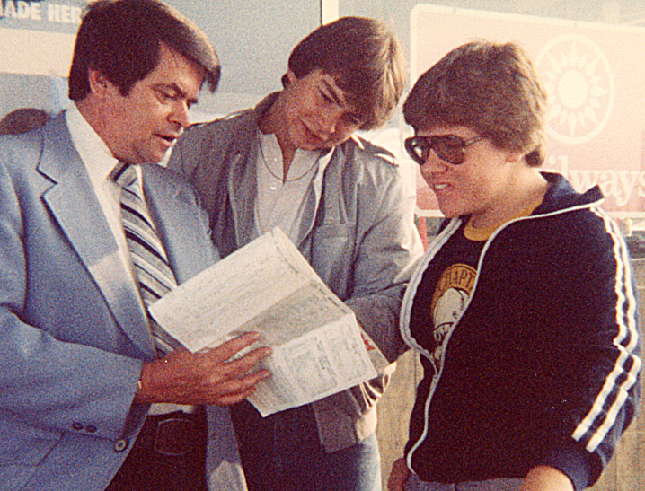 Three men examining a map.