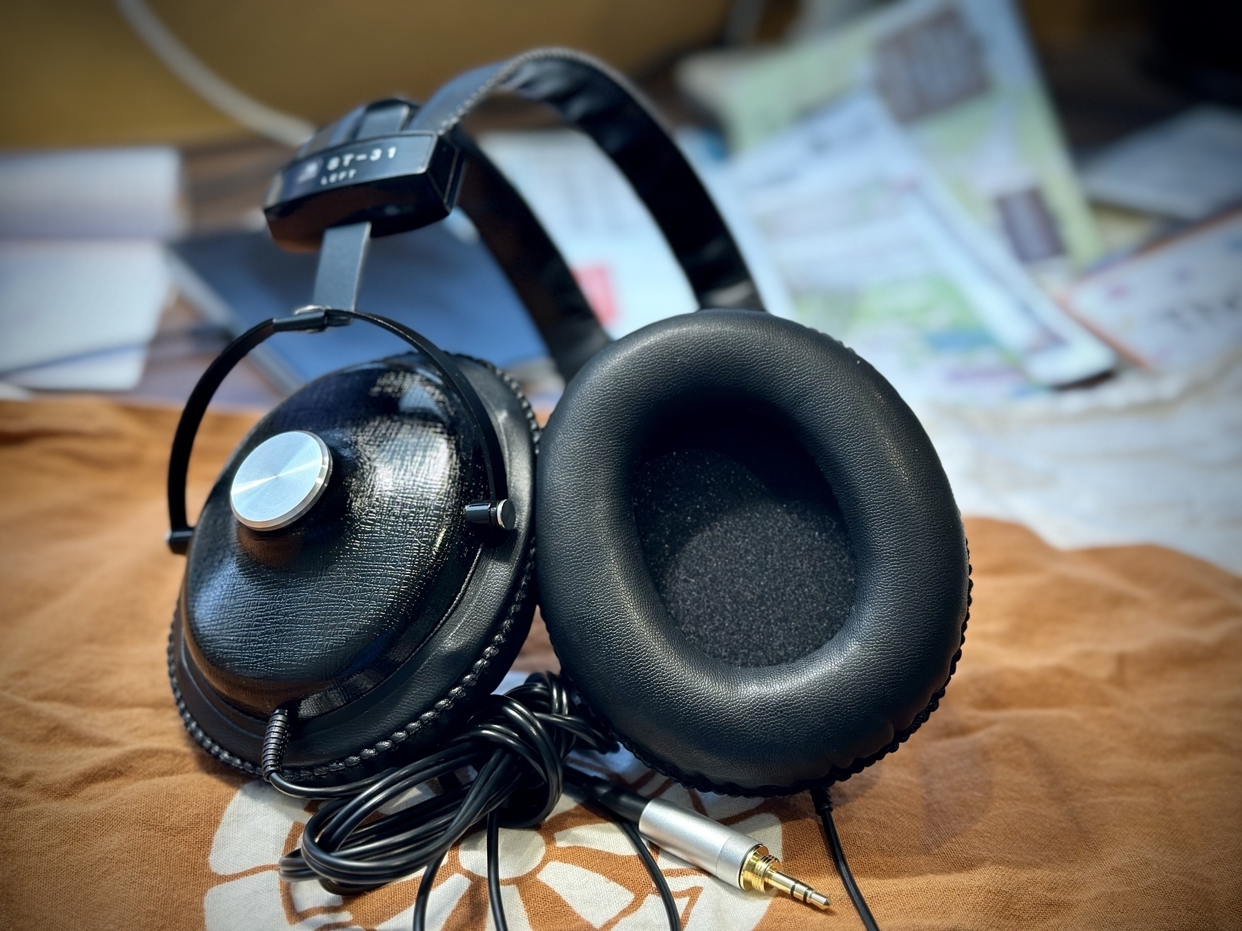 Wired Headphones from AshidaVox sitting on a tenugui cloth. 