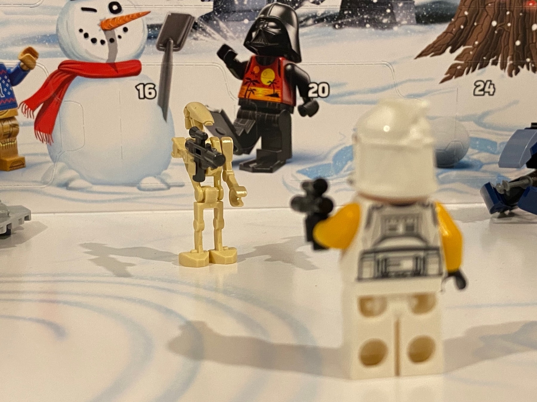 the Lego droid trooper facing off against the clone trooper from earlier, both pointing their lego guns at each other