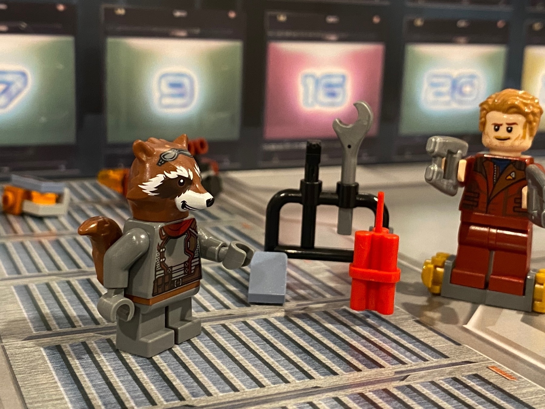 Lego Rocket Racoon standing next to the Lego tool rack from yesterday