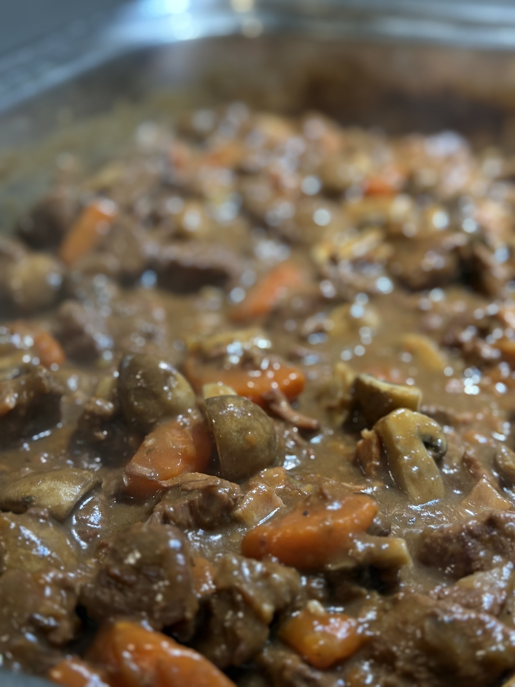 A close up photo of a beef and mushroom stew that’s going to go into a pie 