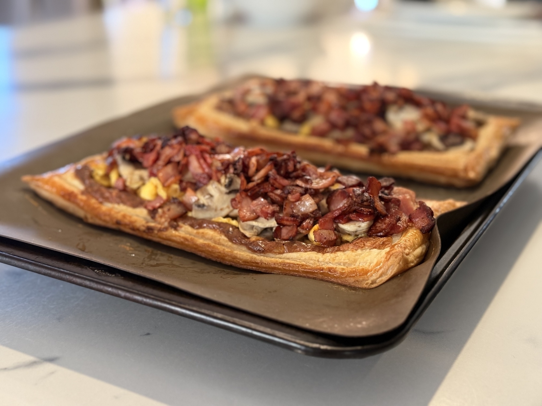 Two mushroom egg and bacon tarts made by my kids for breakfast for Father’s Day. &10;&10;Seriously delicious. 