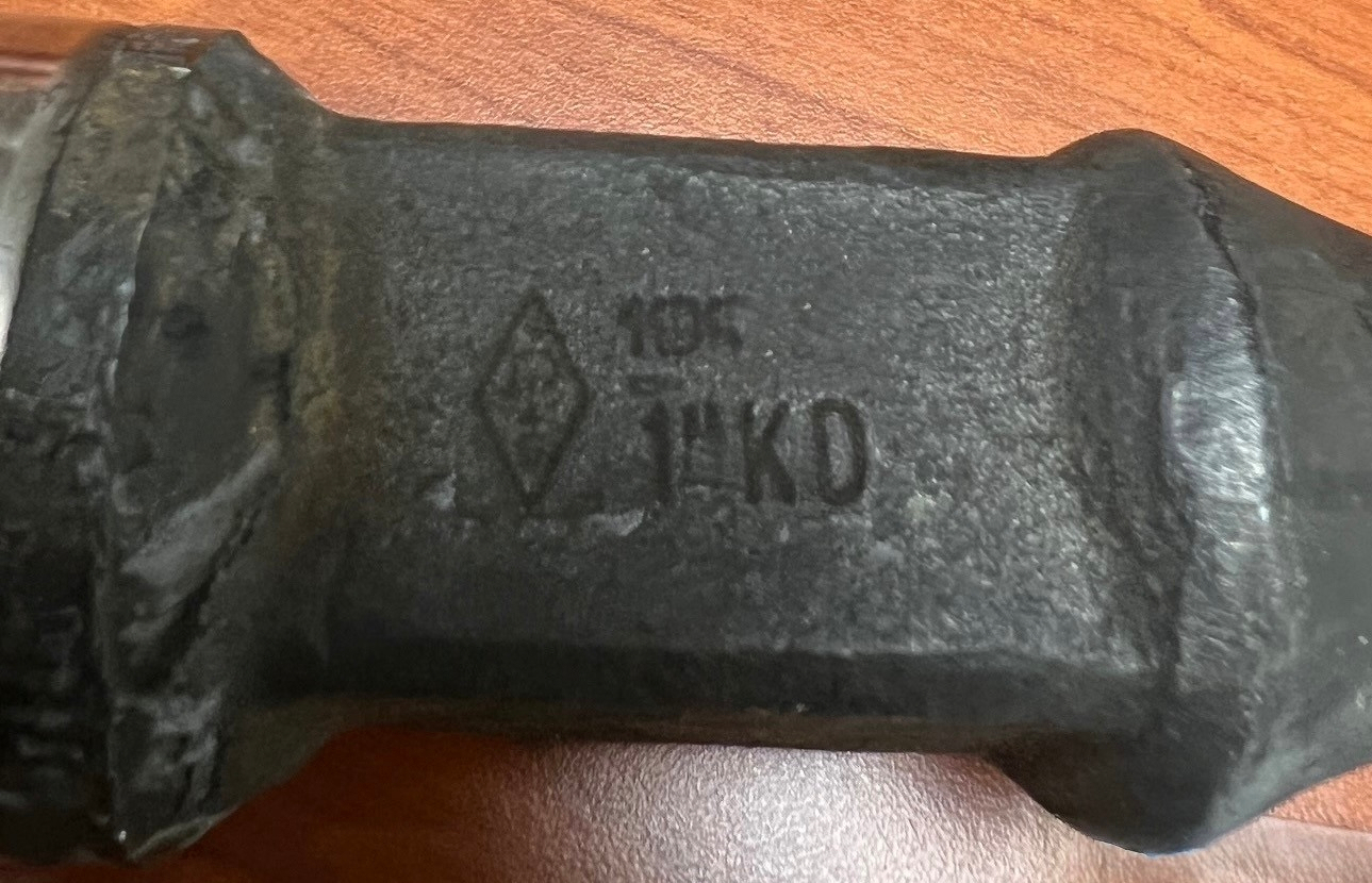 Sucker rod with the API Monogram (diamond mark on the left).