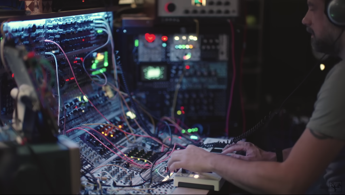 Screenshot of a Youtube video of a man playing a modular synth