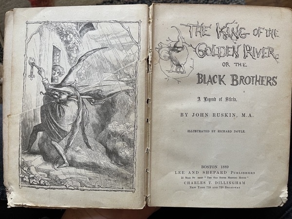 A picture of the title page of The King of the Golden River with a woodcut drawing of a scary fairy opposite the title text