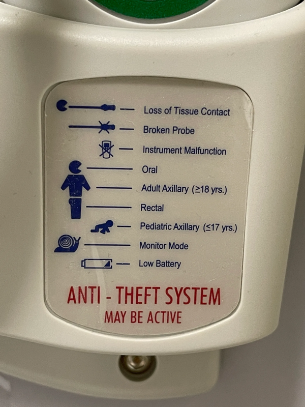 A diagram on a thermometer showing chunky icons next to different labes: "Loss of Tissue Contact," "Broken Probe," "Instrument Malfunction," "Oral," "Adult Axillary (>18 yrs.)," "Rectal" "Pediatric Axillary (<17 yrs)," "Monitor Mode," and "Low Battery," with the words below, "ANTI_THEFT SYSTEM / MAY BE ACTIVE"