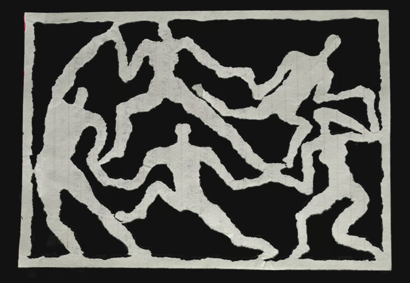 A photo of a paper cutout of the Matisse painting La Danse, where five figures dance in a circle
