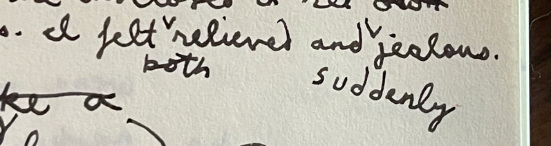 A scan of a scrap of paper with some cursive handwriting on it reading "I felt both relieve and suddenly jealous." The words "both" and "suddenly" have been added in during editing through use of carats.
