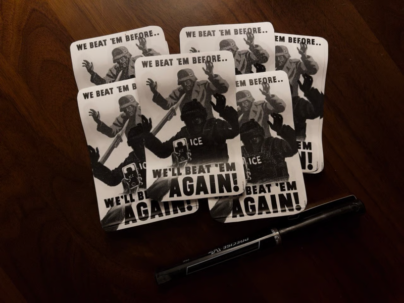An array of six stickers reading "WE BEAT EM BEFORE... WE'LL BEAT EM AGAIN" and showing a Nazi getting bayonetted and an ICE agent getting filmed on camera.
