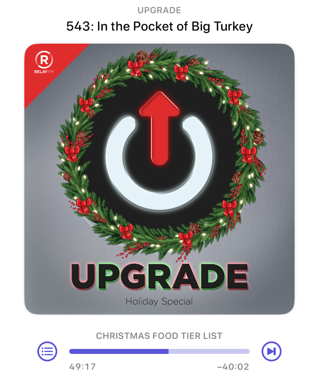 A podcast episode cover titled Upgrade: Holiday Special features a wreath surrounding a power symbol with an upward arrow and includes a play bar indicating a Christmas Food Tier List segment.