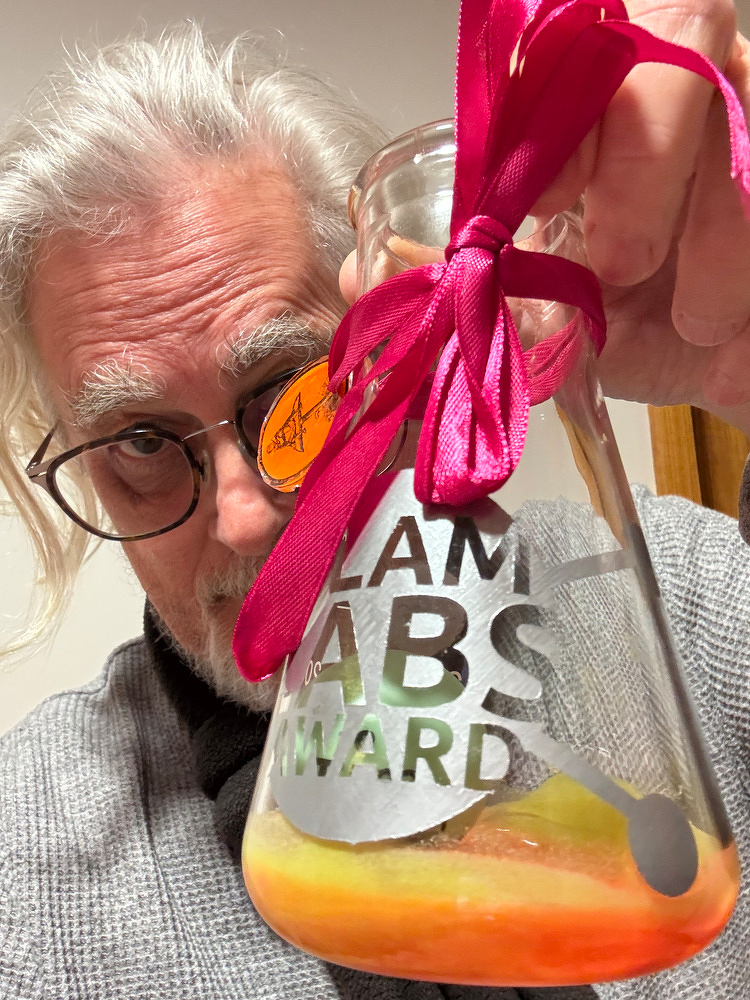 Photograph of me holding the award