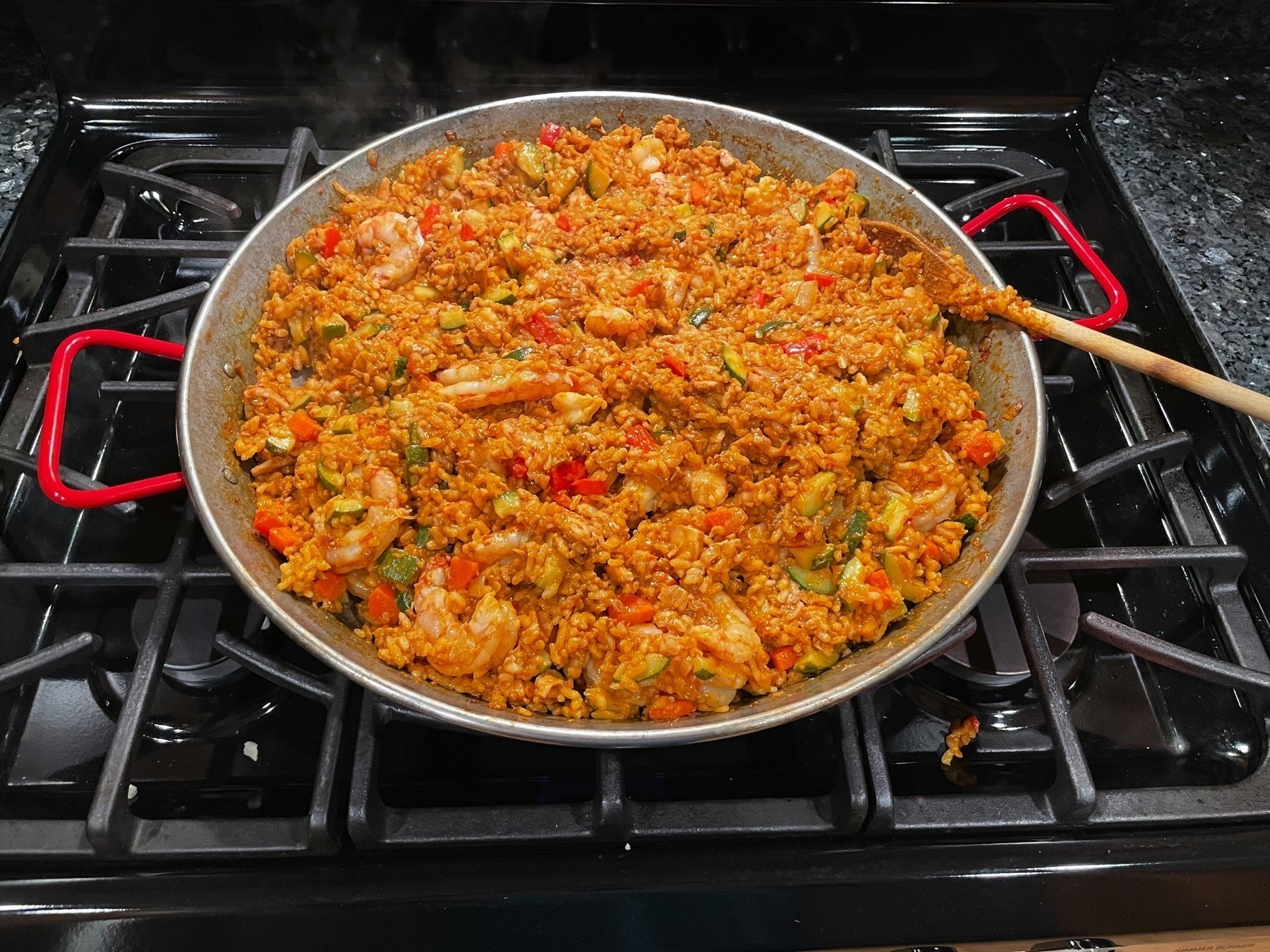 Fully cooked paella in paella pan.