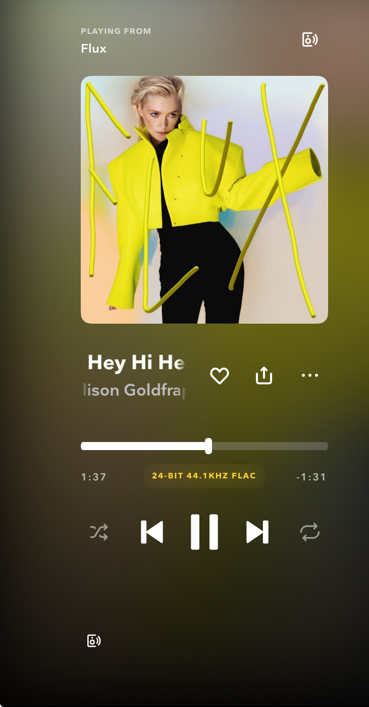 A music player interface displays the song "Hey Hi Hello" by Alison Goldfrapp from the album "Flux," featuring an image of a person in a bright yellow jacket.