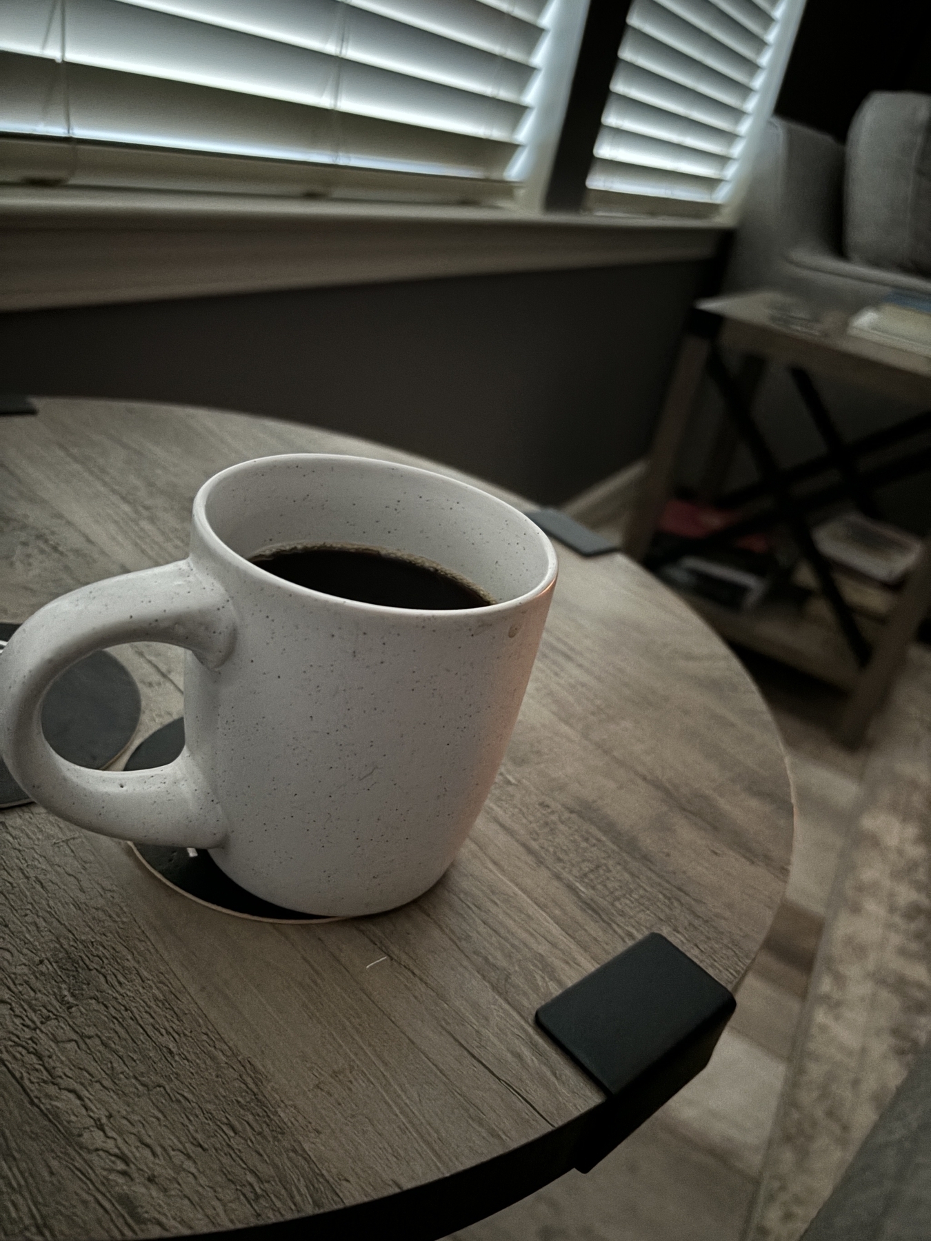 A coffee mug on a side table. 