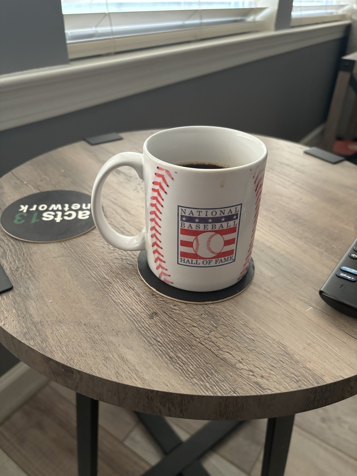 National baseball hall of fame coffee mug on a side table