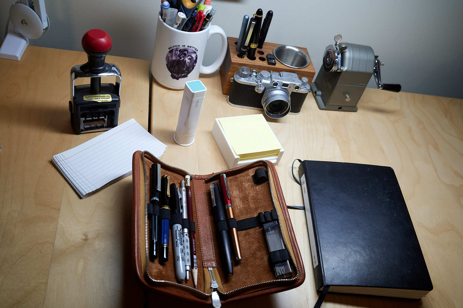 My pen holder, notebook, post-its, date stamp, index cards, and glue. Mmmmm. 