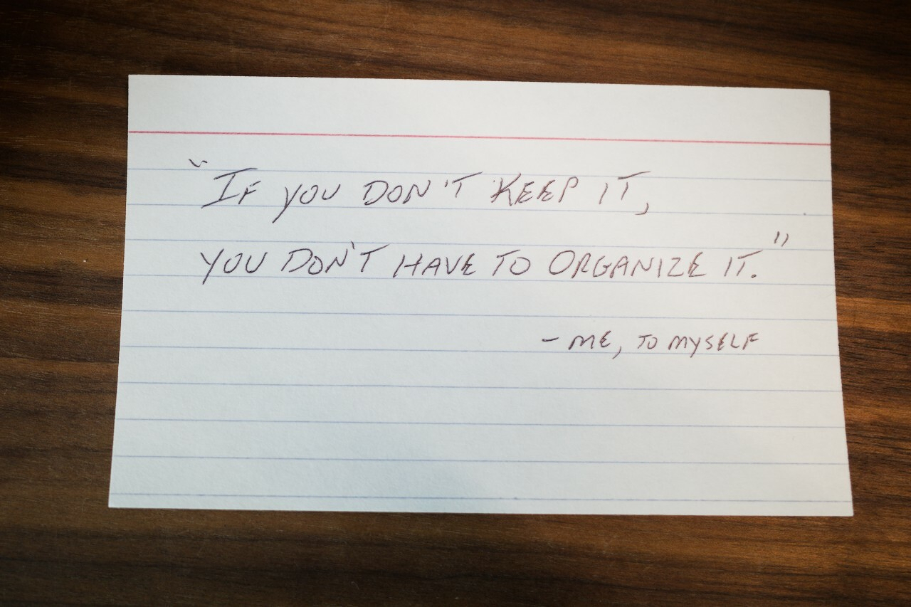 Index card with note: "If you don't keep it, you don't have to organize it"