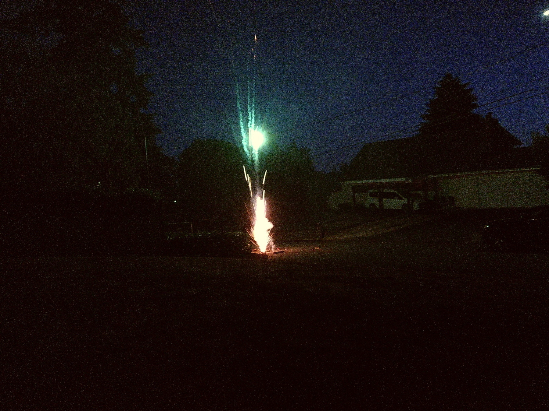 fountain style fireworks shooting upwards at night