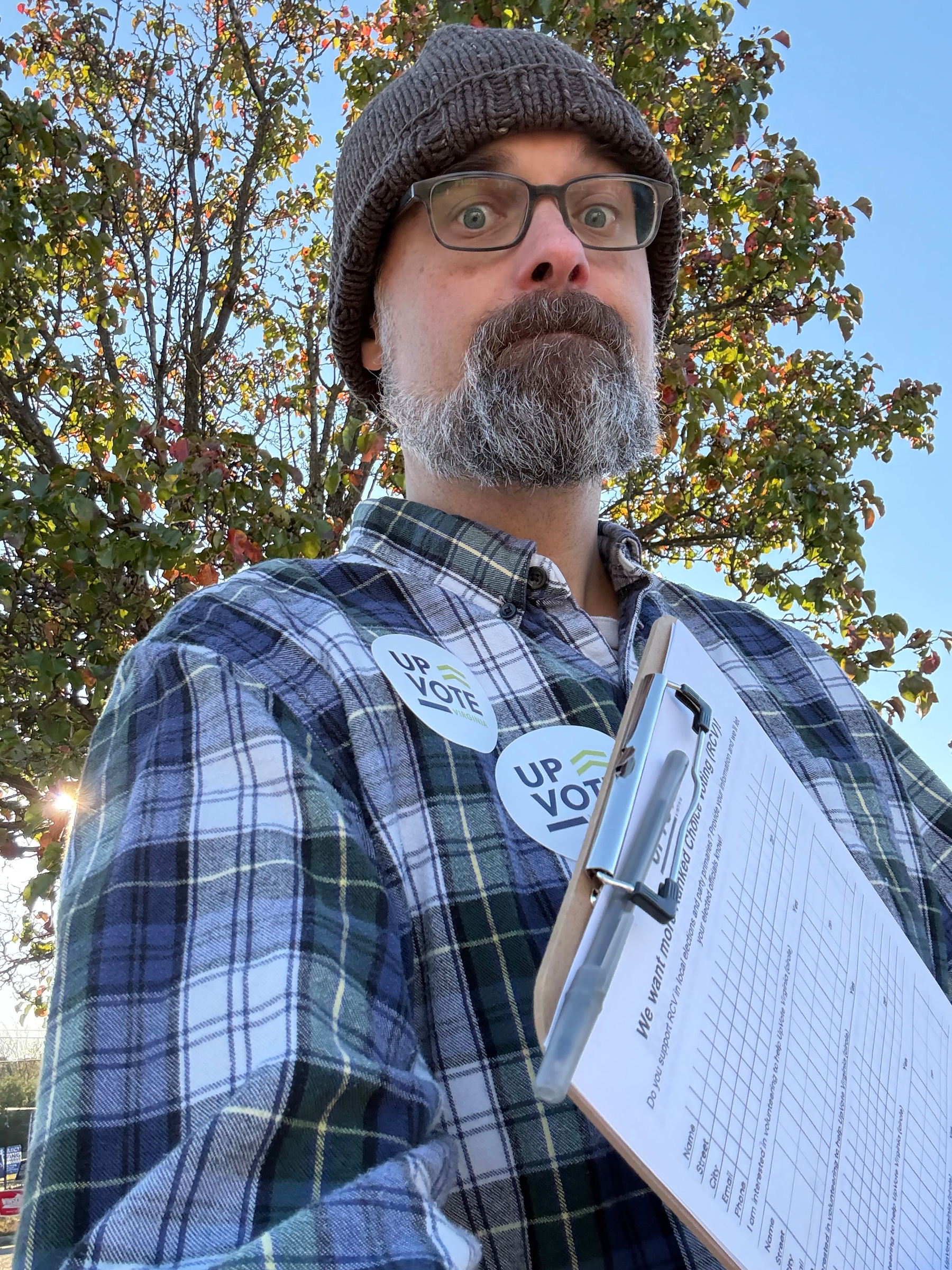 Sam holds a clipboard.