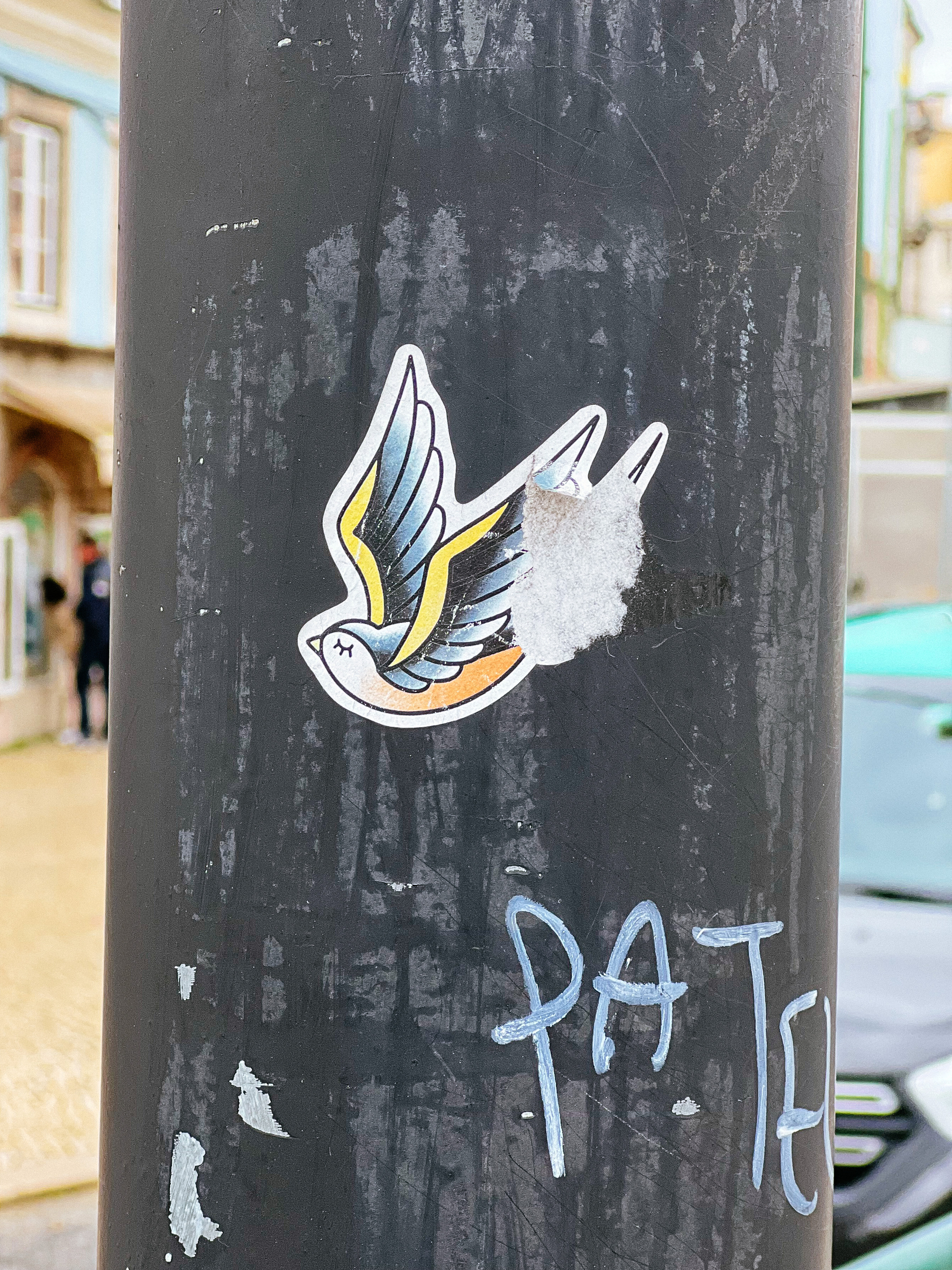 Sticker with the design of a classic swallow tattoo. 