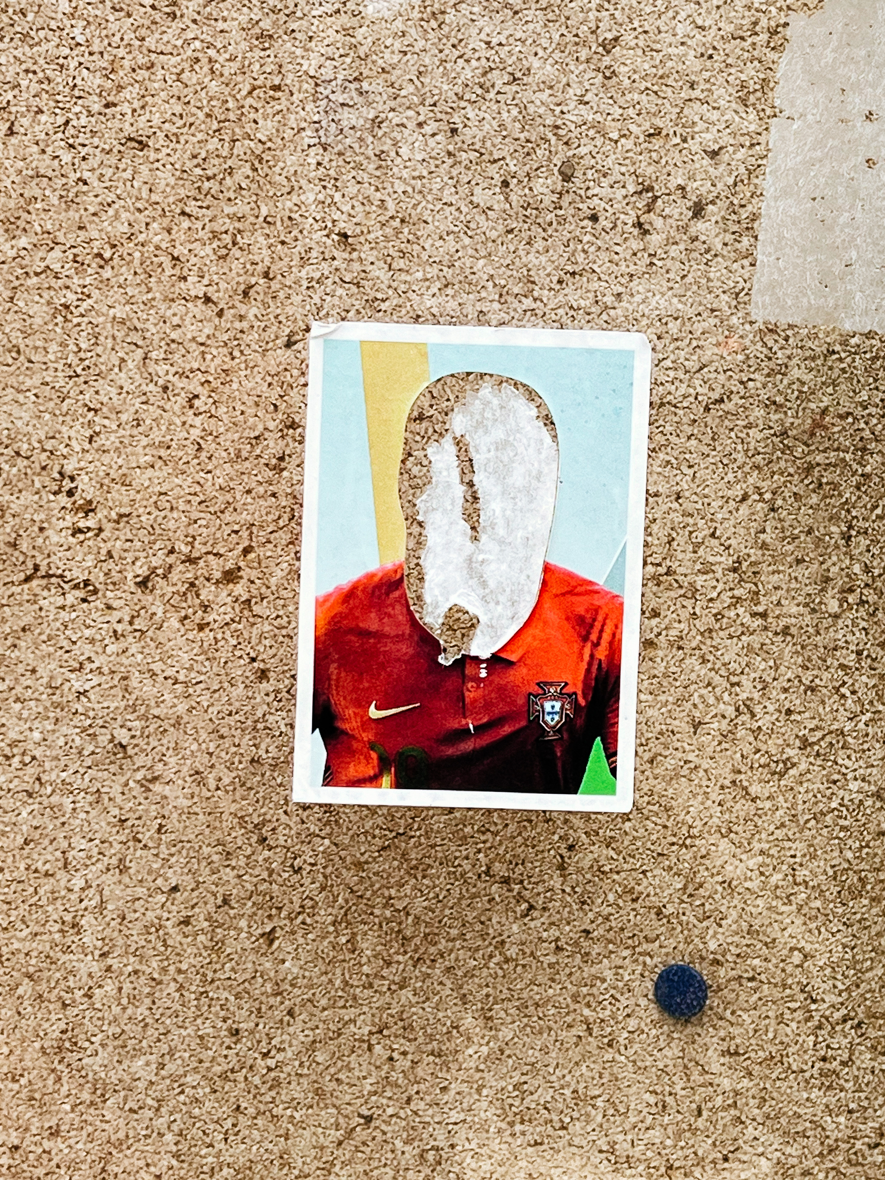 Sticker with a photo of a Portuguese national football team player, with his head defaced. 