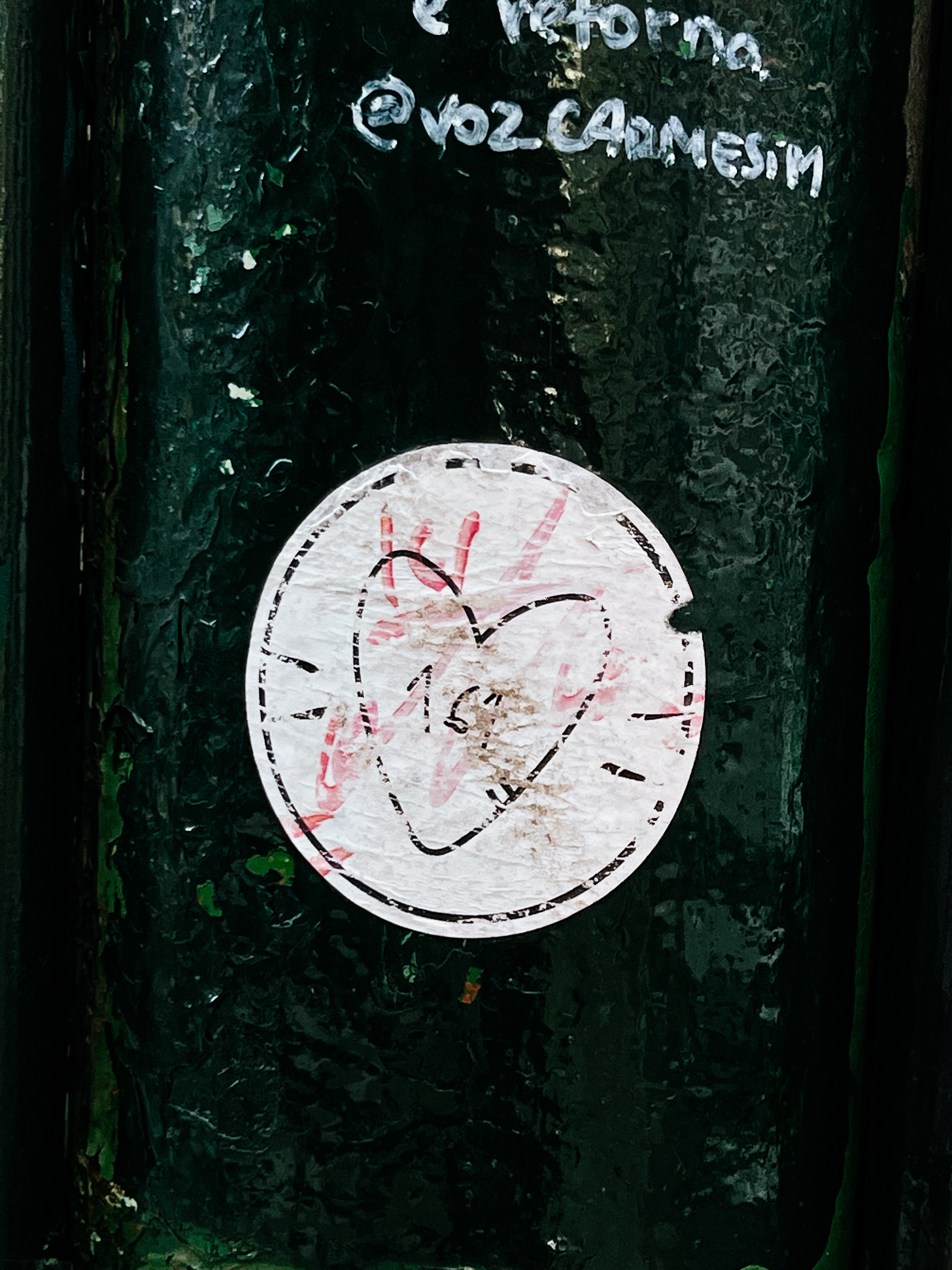 Sticker with a barely visible drawing of a heart. 