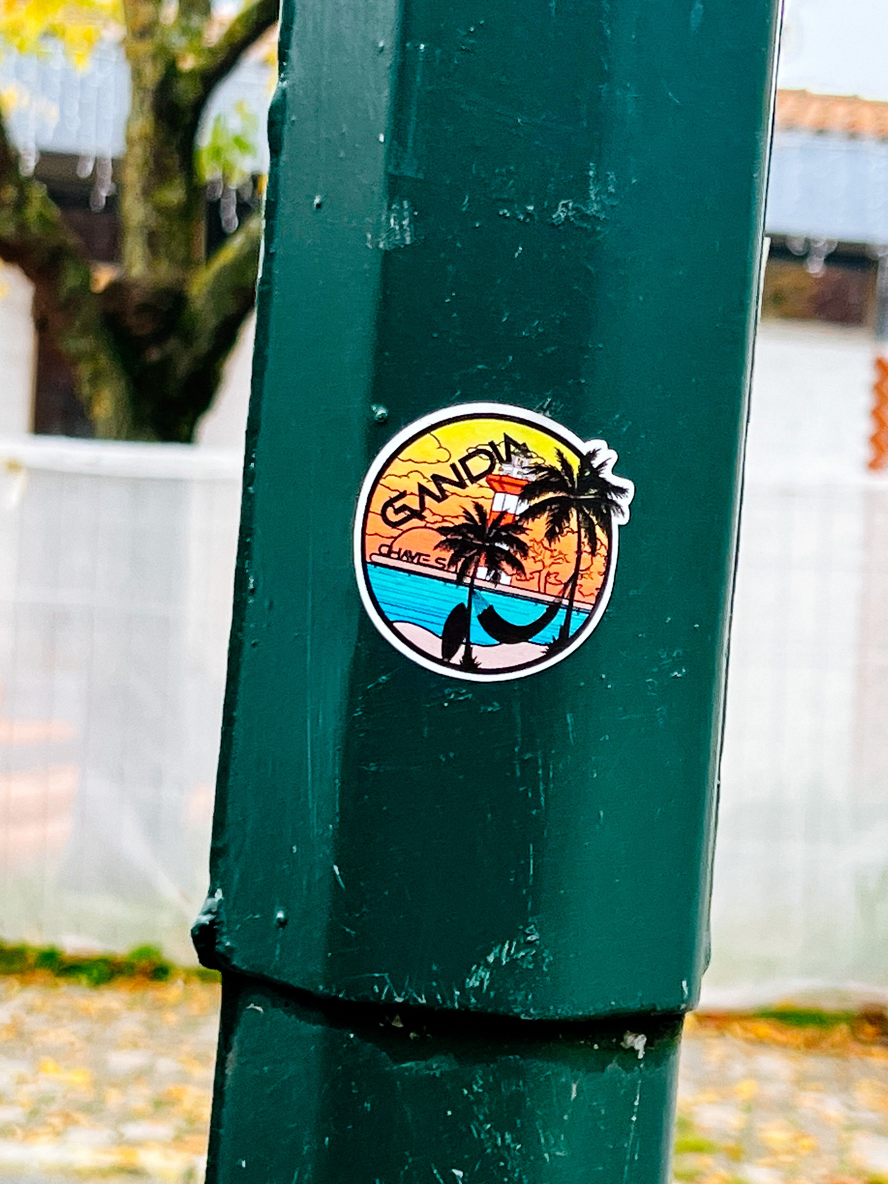 Sticker for “Gandia”, with palm trees and a lighthouse. 